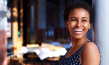 Image Text: 500x332_0032_smiling young black woman standing outside