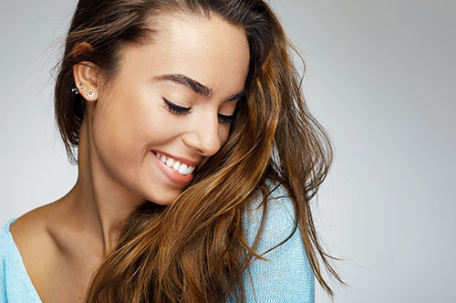 Image Text: 500x332_0075_Portrait of a young woman with a beautiful smile